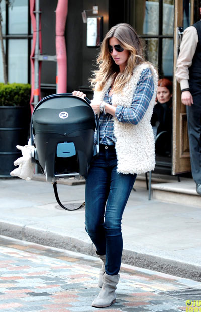 Gisele Bundchen rocks plaid while exiting her hotel with her baby daughter Vivian on Tuesday (April 30) in London, England.